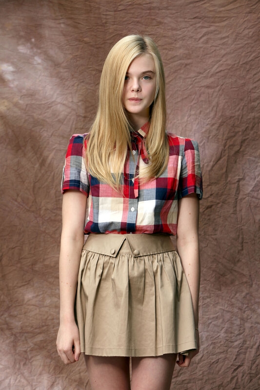 Young Woman in Plaid Shirt — Red, Neutral, Photograph