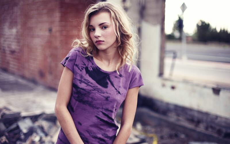 Young Woman in Purple Shirt — Serious