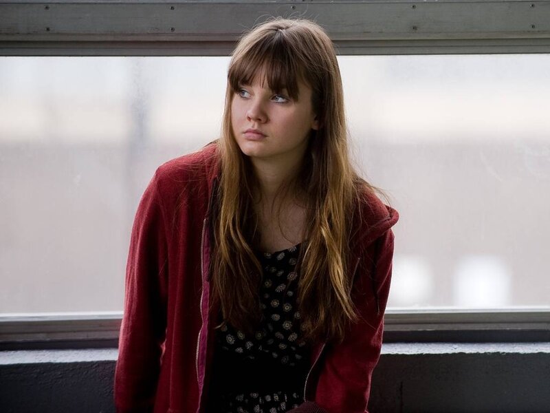 Young Woman in Red Jacket — Contemplative