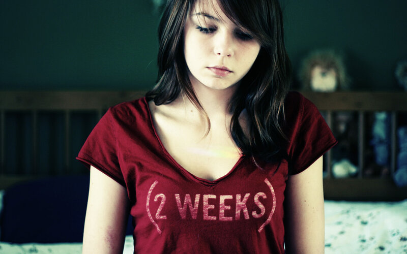 Young Woman in Red Shirt — Somber