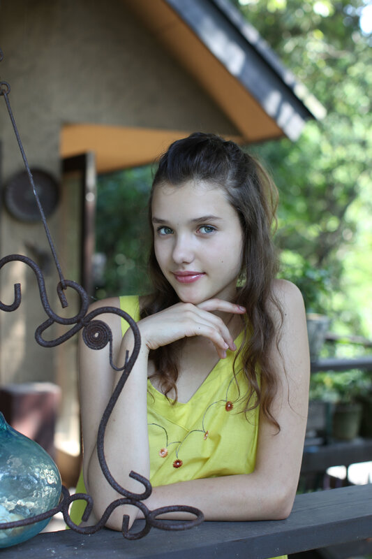 Young woman in yellow top