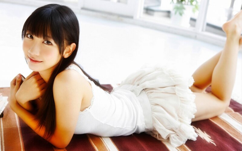 Young Woman Lying Down — White, Calm, Afternoon