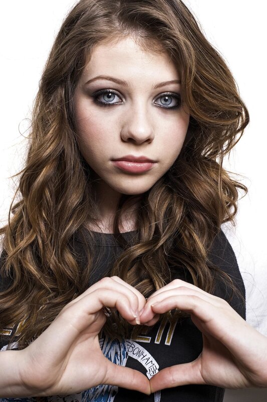 Young Woman Making Heart — Brown