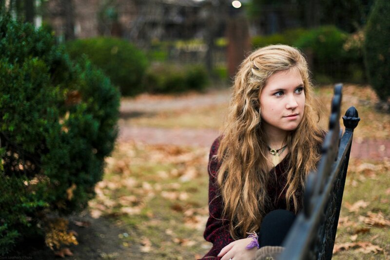 Young Woman on Bench — Brown