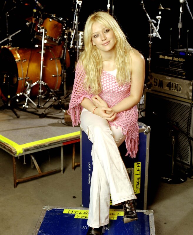 Young woman on stage equipment