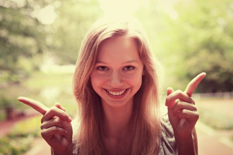 Young Woman Pointing — Green