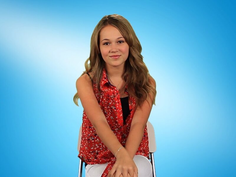 Young Woman Sitting — Blue
