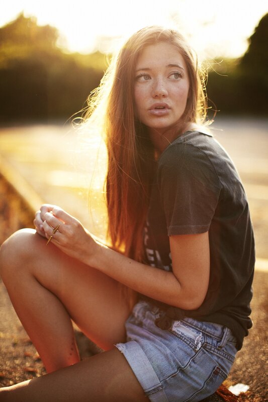 Young Woman Sitting Outside