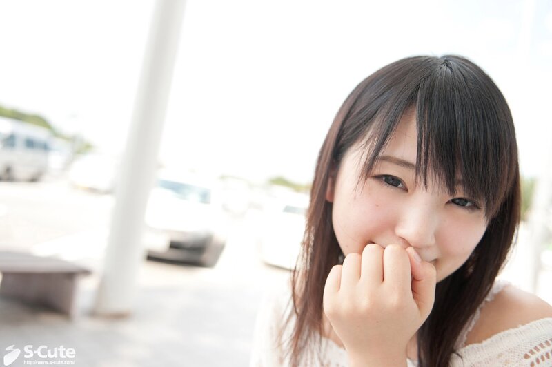 Young woman smiling outdoors