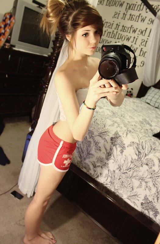 Young Woman Taking Mirror Selfie