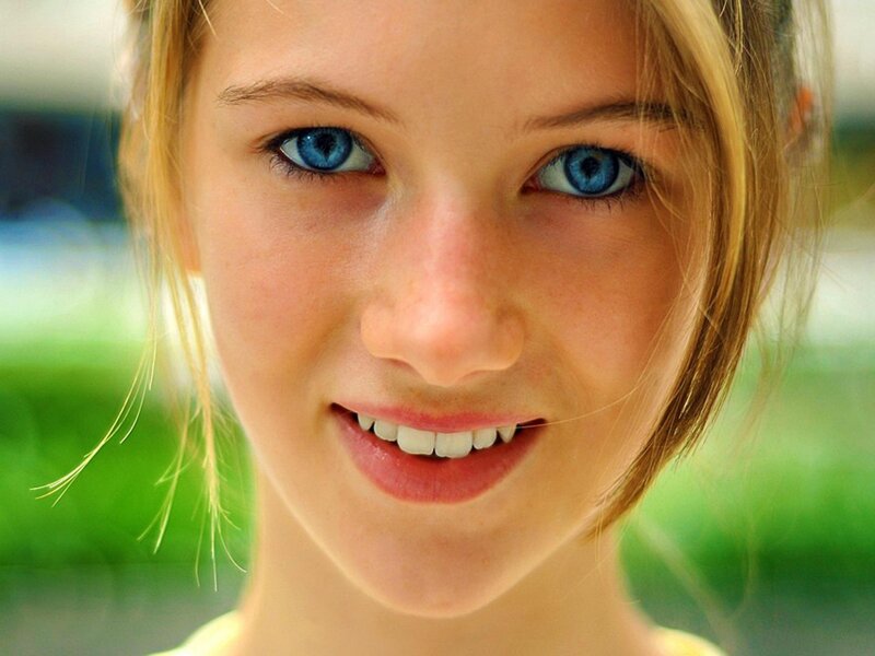 Young Woman with Blue Eyes — Happy