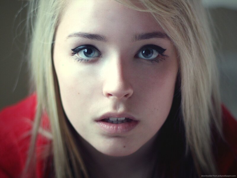 Young Woman with Blue Eyes — Red, Intense, Photograph