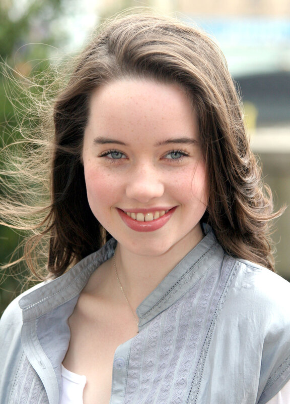 young woman with blue eyes smiling