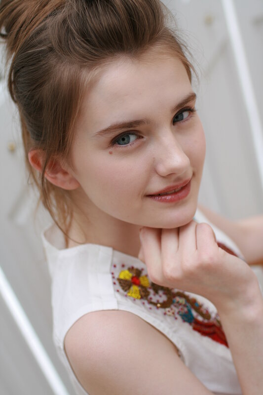 Young Woman with Blue Eyes — White, Calm