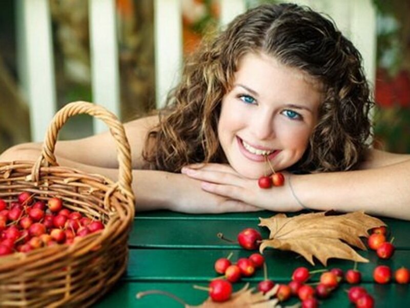 Young Woman with Cherries