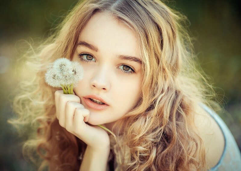 Young Woman with Dandelion