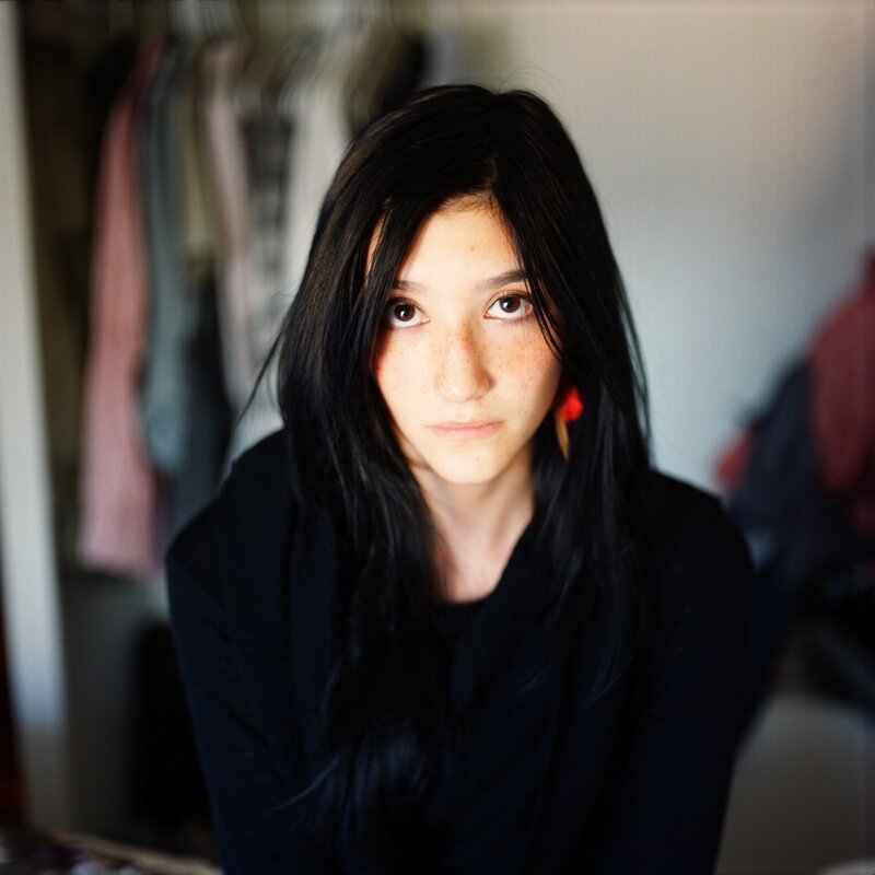 Young Woman with Dark Hair — Black, Neutral, Photograph