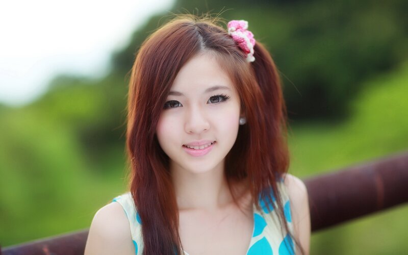 young woman with pink hair accessory