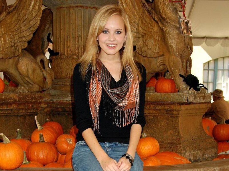 Young Woman with Pumpkins