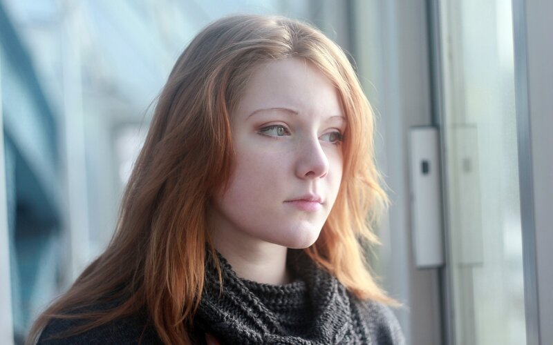 Young Woman with Red Hair — Contemplative