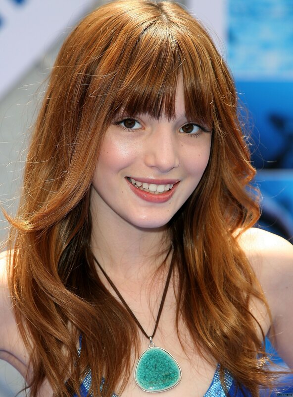 Young woman with red hair smiling