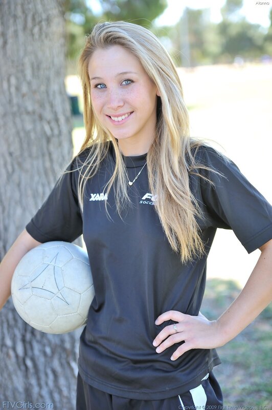 Young woman with soccer ball