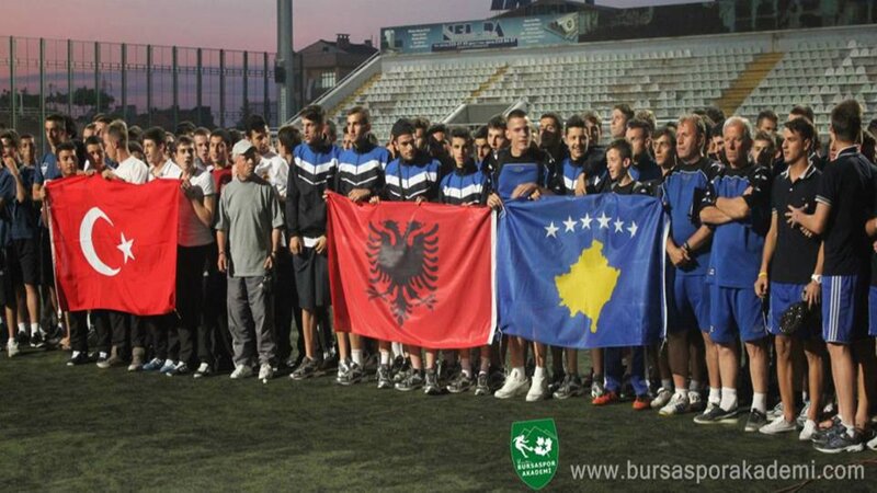 Youth football team with flags
