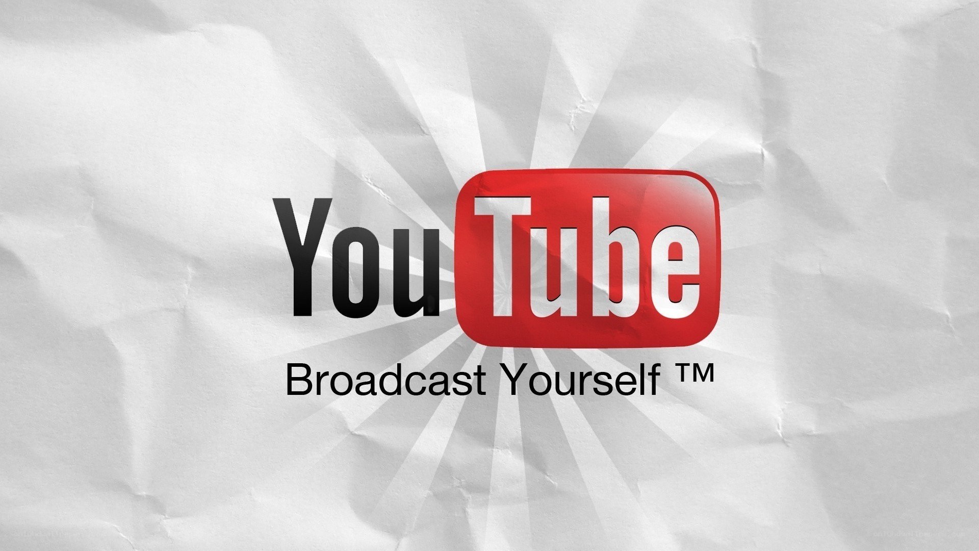 YouTube logo on crumpled paper