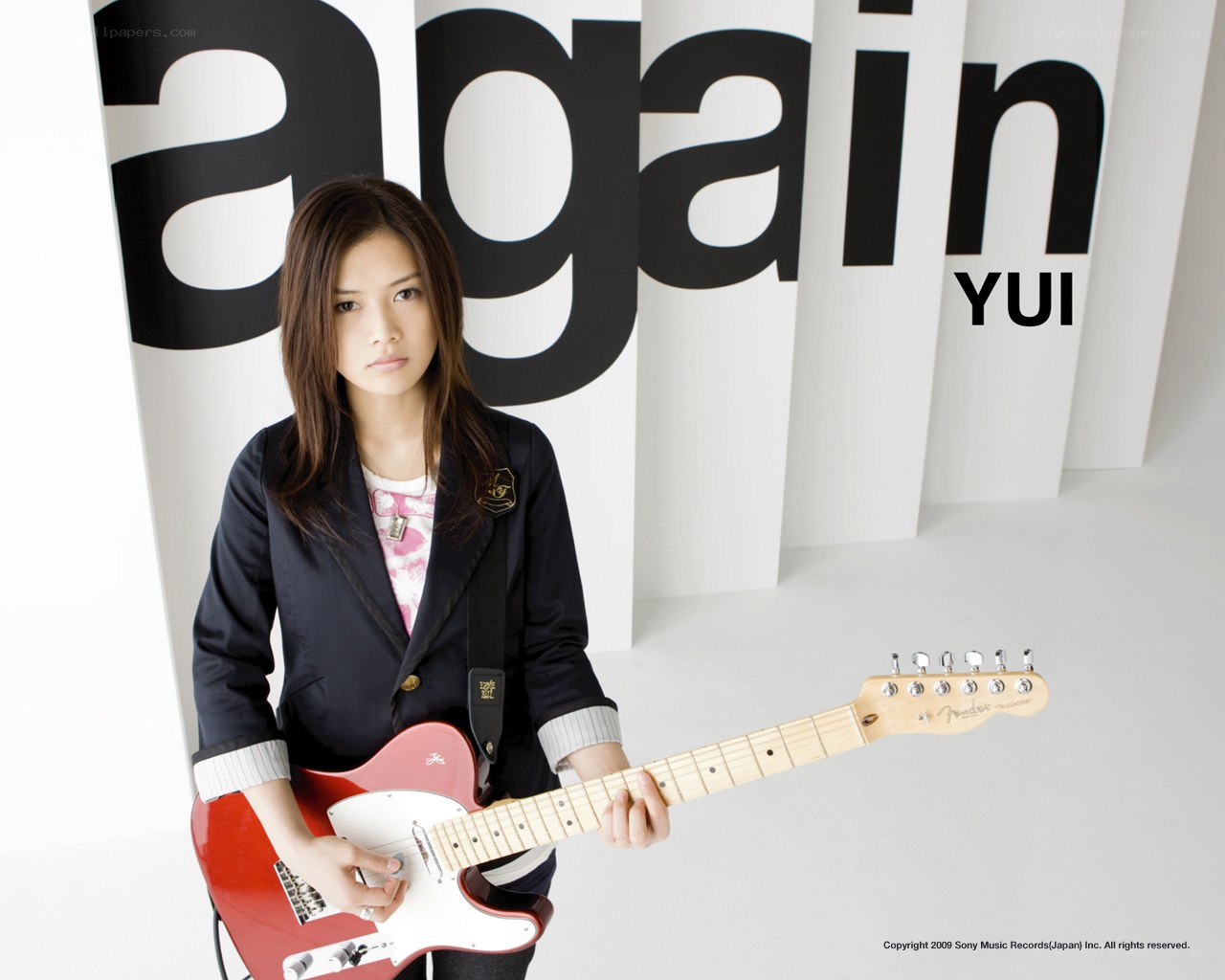 Yui with red electric guitar