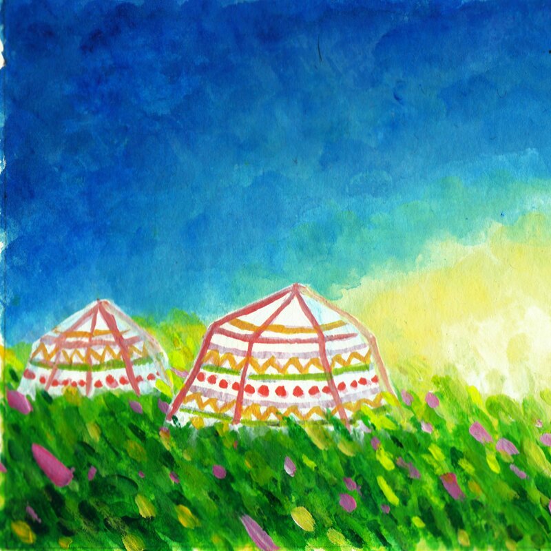 Yurts in a colorful field