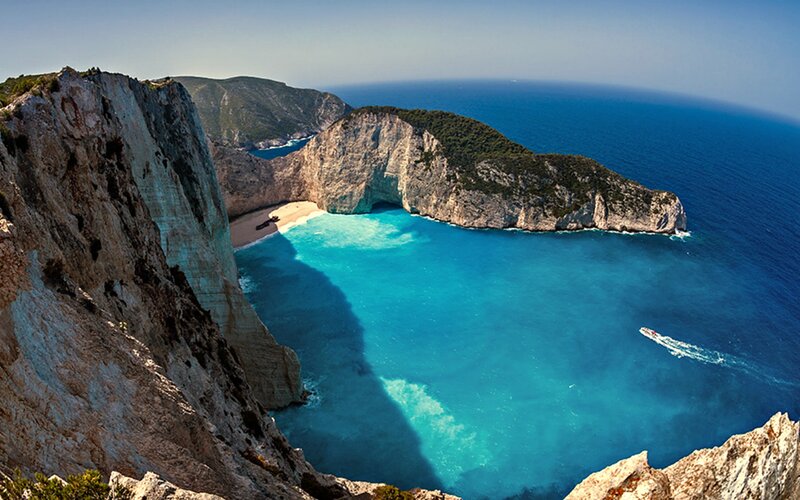 Zakynthos Beach Cove — Blue, Serene, Afternoon, Photograph, Cliffs, Boat