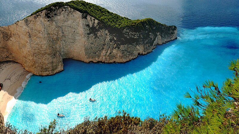 Zakynthos Beach Cove — Blue, Serene, Afternoon, Photograph, Cliffs, Boats, Pine Trees