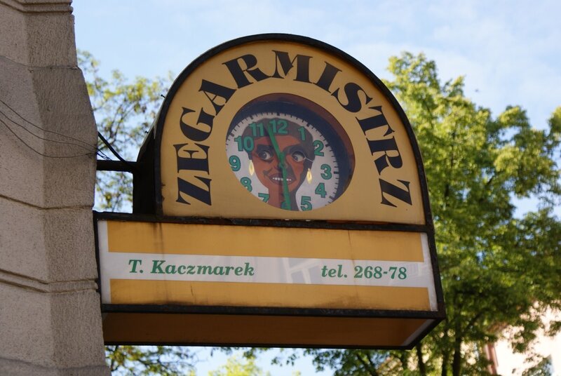 Zegarmistrz sign with clock face