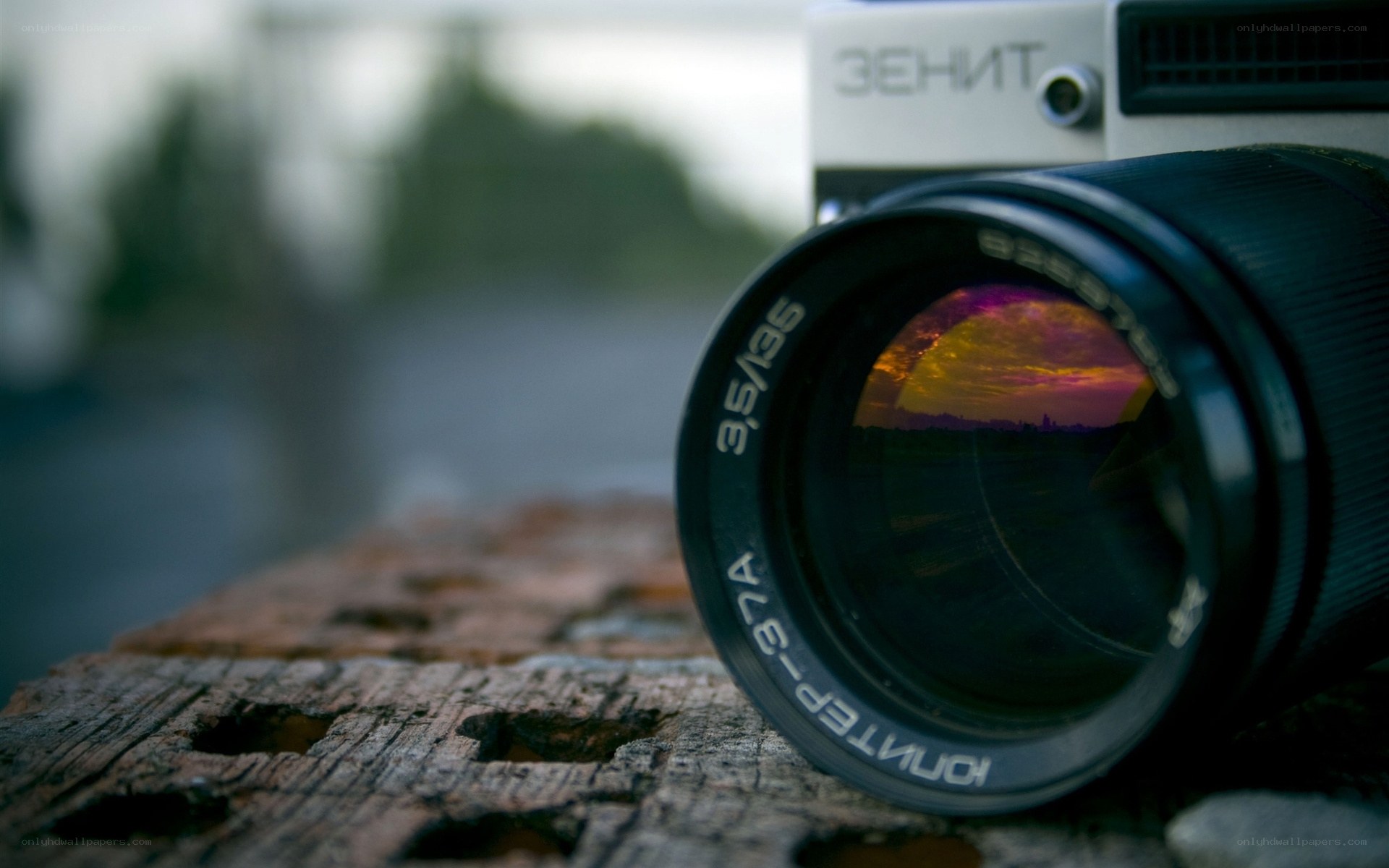 Zenit camera with sunset reflection