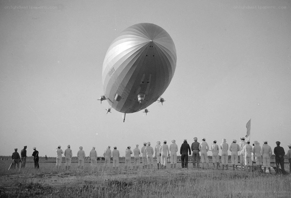 Zeppelin lifting off from field