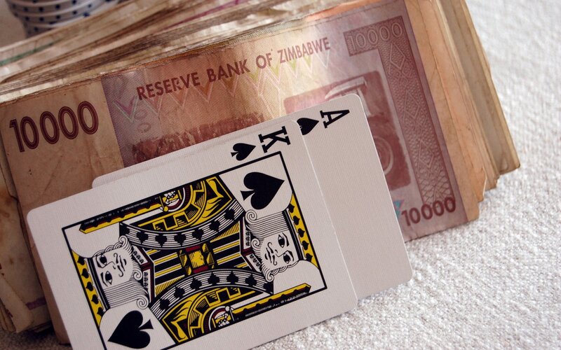 Zimbabwean money and playing cards
