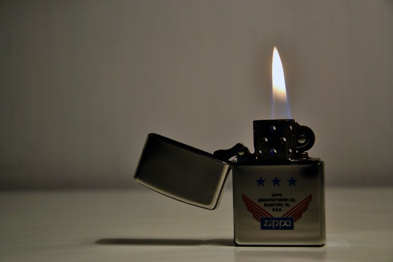 Zippo Lighter with Flame — Silver, Dramatic, Photograph, Stars